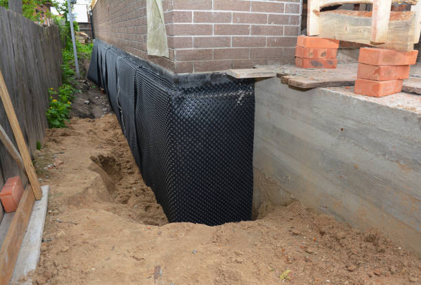SJ Waterproofing Pros technician performing targeted Interior Drainage System assessment in Marshall, VA